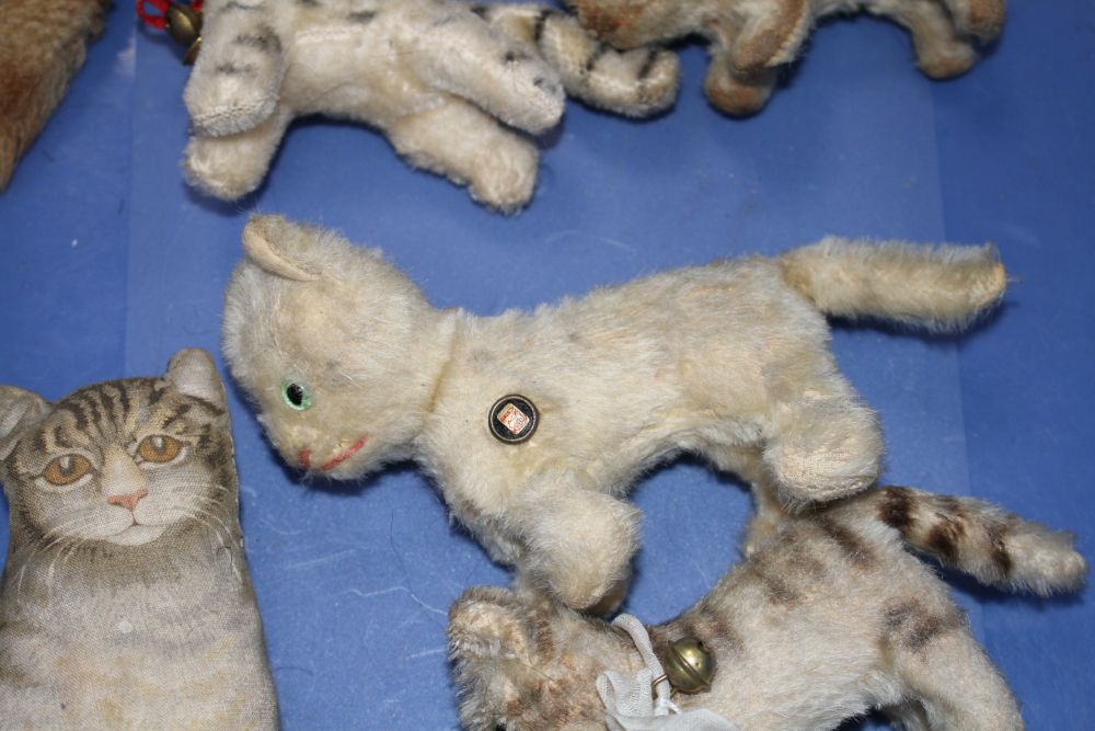 A group of assorted vintage soft toy cats including Steiff